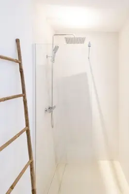 a shower with a ladder in a white bathroom at Villa Renajolo 6 pers 3 min plage en voiture in Sainte-Lucie de Porto-Vecchio