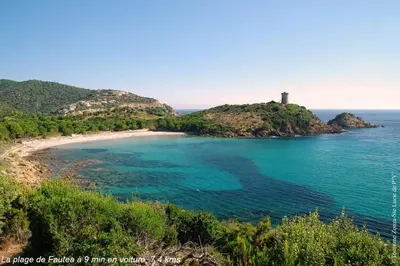 an island with a lighthouse in the middle of the ocean at Villa Renajolo 6 pers 3 min plage en voiture in Sainte-Lucie de Porto-Vecchio