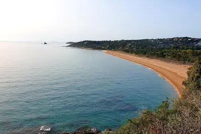 a view of a beach and the ocean at L'Original, Superbe appartement à 5min de la plage in Zonza