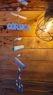 a sign that says cisco hanging on a wooden wall at L'Original, Superbe appartement à 5min de la plage in Zonza