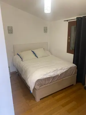 a small bedroom with a bed in a room at CHAMBRES D'HOTES CENTRE CORSE in Venaco