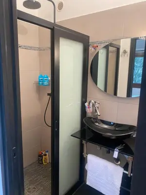 a bathroom with a sink and a mirror at CHAMBRES D'HOTES CENTRE CORSE in Venaco