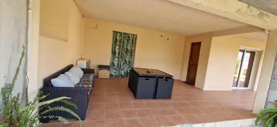 a living room with a couch and a table at corse in Appietto