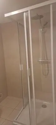 a shower in a bathroom with a glass door at corse in Appietto