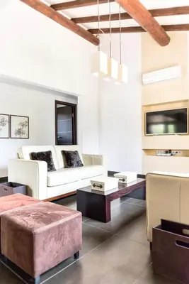 a living room with a bed and a tv at **** VILLA CASA DI FIUMU **** in Porto-Vecchio
