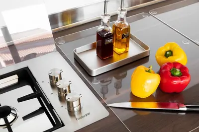 a counter top with two peppers and a knife at **** VILLA CASA DI FIUMU **** in Porto-Vecchio