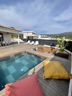 a swimming pool on top of a house at Villa U Pastore in Porticcio