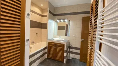 a bathroom with a sink and a tub and a mirror at T3 de 140m2 pour 7 pers- Extra centre Ajaccio - À 5 min à pied des plages - Classé 5 étoiles - CASA DI ARTISTI in Ajaccio