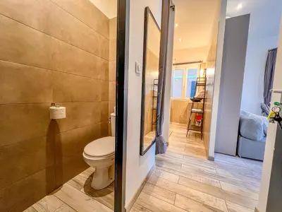 a bathroom with a toilet and a walk in shower at Les Studios du Pêcheur - Hypercentre - Clim - City Trip in Ajaccio