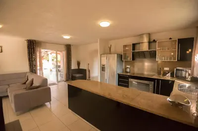 two coffee cups sitting on a counter in a kitchen at Residence de tourisme Le clos des Vendanges in Moriani Plage