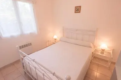 a bathroom with a sink and a tub and a mirror at Residence de tourisme Le clos des Vendanges in Moriani Plage