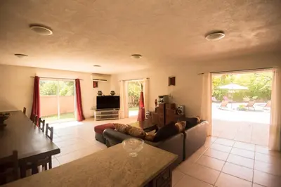 a living room with a couch and a table at Residence de tourisme Le clos des Vendanges in Moriani Plage