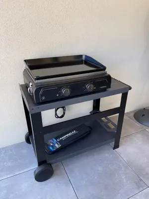 a grill sitting on a table with at APPART-NEUF-VUE MER- 6 PERS in Propriano