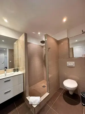 a bathroom with a shower and a toilet and a sink at ALTO DI PINARELLO in Sainte-Lucie de Porto-Vecchio