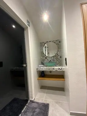 a bathroom with a sink and a mirror at Superbe maison dans village au coeur de la Corse A casa Suttana in Verdese