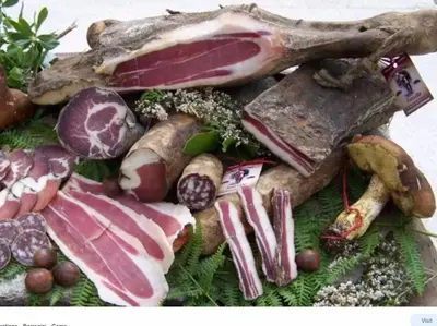 a bunch of different types of meat and vegetables at Superbe maison dans village au coeur de la Corse A casa Suttana in Verdese