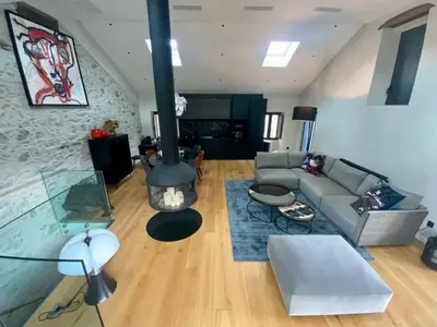 a living room with a couch and a fireplace at Superbe maison dans village au coeur de la Corse A casa Suttana in Verdese