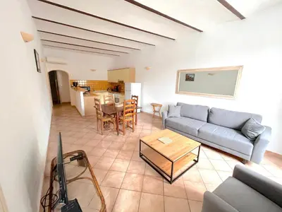 a living room with a couch and a table at Appartements Bonifacio AcquaViva in Bonifacio