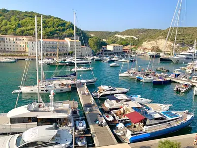 a bunch of boats are docked in a harbor at Appartements Bonifacio AcquaViva in Bonifacio