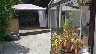 a patio with a potted plant and an umbrella at Casa Di Vadella in Santʼ Andrea-di-Cotone