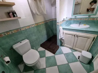 a bathroom with a toilet and a sink at Casa Di Vadella in Santʼ Andrea-di-Cotone