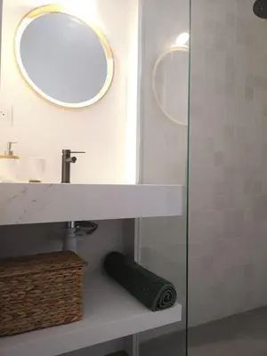 a bathroom with a sink and a mirror at Destinu Marinella in Ajaccio