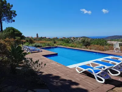 a swimming pool with chaise lounge chairs next to it at Villa Pol & Dod - Piscine et vue sublime in Monacia-dʼAullène