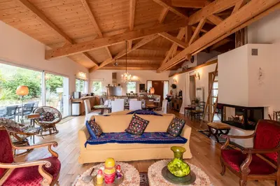 a bedroom with a bed and a living room at Villa Pol & Dod - Piscine et vue sublime in Monacia-dʼAullène