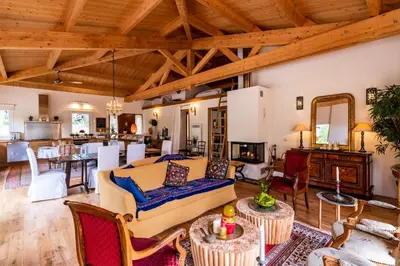 a living room with a couch and a table at Villa Pol & Dod - Piscine et vue sublime in Monacia-dʼAullène