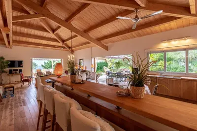 a large dining room with a long table and chairs at Villa Pol & Dod - Piscine et vue sublime in Monacia-dʼAullène