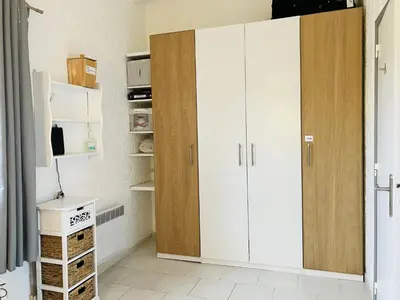 a kitchen with white cabinets and a door at Holiday Home Villa Irène by Interhome in Linguizzetta