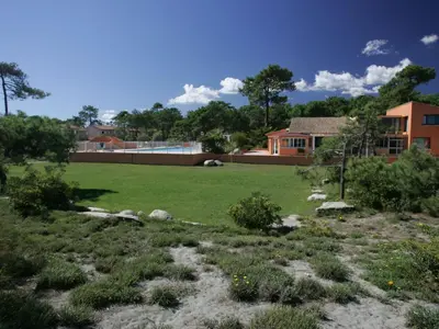 a yard with a large field of grass at Holiday Home T2 Cabine Type C by Interhome in Borgo