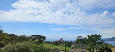 a cloudy sky with the ocean in the background at Grand & beau studio climatisé vue sur mer in Propriano