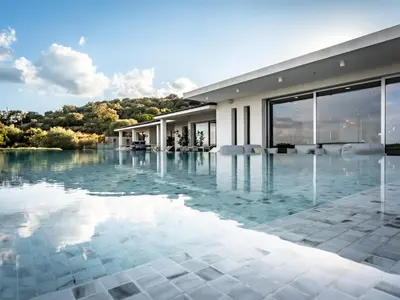 a swimming pool in a villa with a view at Porto-Vecchio Palombaggia Villa Azaïtù in Porto-Vecchio