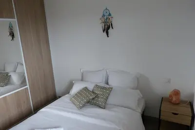 a bedroom with two bunk beds with a stuffed animal on the bed at T3 Le Myrte vue Mer & Montagne idéalement situé in Propriano