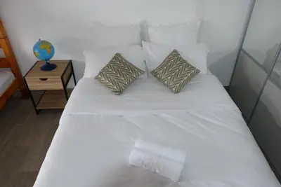two bunk beds in a room with a window at T3 Le Myrte vue Mer & Montagne idéalement situé in Propriano