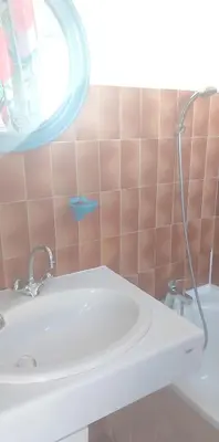 a bathroom with a sink and a mirror at Appartement cosy à Grosseto-Prugna - Vue sur la mer, 42 m² in Grosseto-Prugna