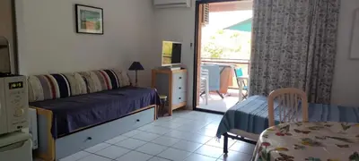 a bedroom with a bed and a bed and a window at MORIANI STUDIO CABINE CLIMATISE 4 à 5 pers in San-Nicolao