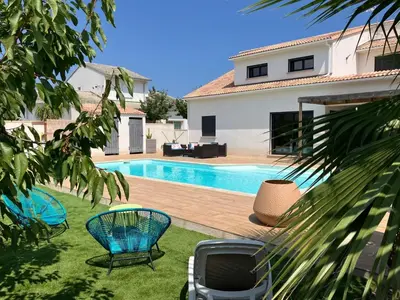 a swimming pool in the backyard of a house at Très belle villa avec piscine chauffée CASALEONI in Prunelli-di-Fiumorbo