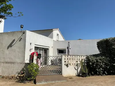 a white house with a fence in front of it at VILLA OCEANE in San-Nicolao
