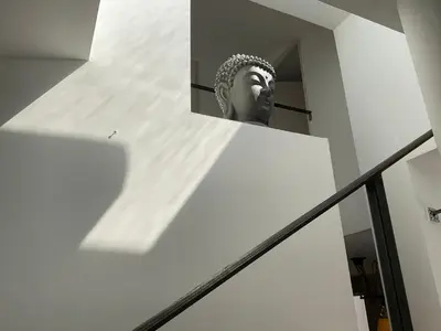 a statue of a head on a stair case at VILLA OCEANE in San-Nicolao