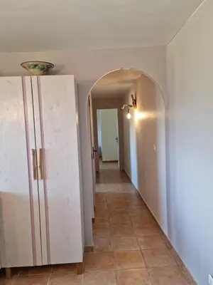 a hallway with an archway leading to a room at L'ortu di Quaprice in Figari