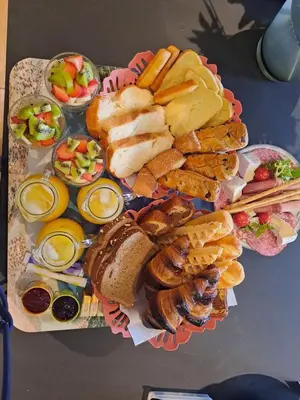 a table with a bunch of different types of food at Le petit chalet de Charlène in San-Gavino-di-Carbini