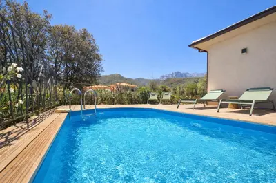 a swimming pool in the backyard of a house at Domaine U Filanciu - Centru di Corsica in Moltifao