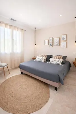 a bedroom with a large bed with a large rug at Domaine U Filanciu - Centru di Corsica in Moltifao