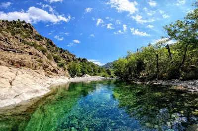 a river in the middle of a canyon at Domaine U Filanciu - Centru di Corsica in Moltifao