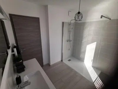 a bathroom with a shower and a sink and a toilet at Cala Rossa, Pinarello, Saint Cyprien - La Villa D'Alice in Lecci