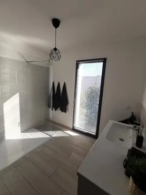a bathroom with a sink and a window at Cala Rossa, Pinarello, Saint Cyprien - La Villa D'Alice in Lecci