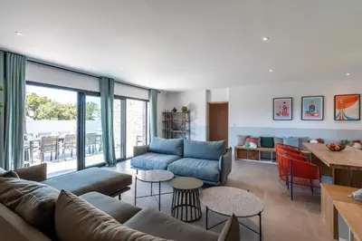 a living room with a couch and a table at Villa Asphodede in Lecci