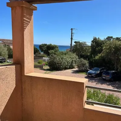 a view from the balcony of a house with a parking lot at Residence Conca Blue in Conca